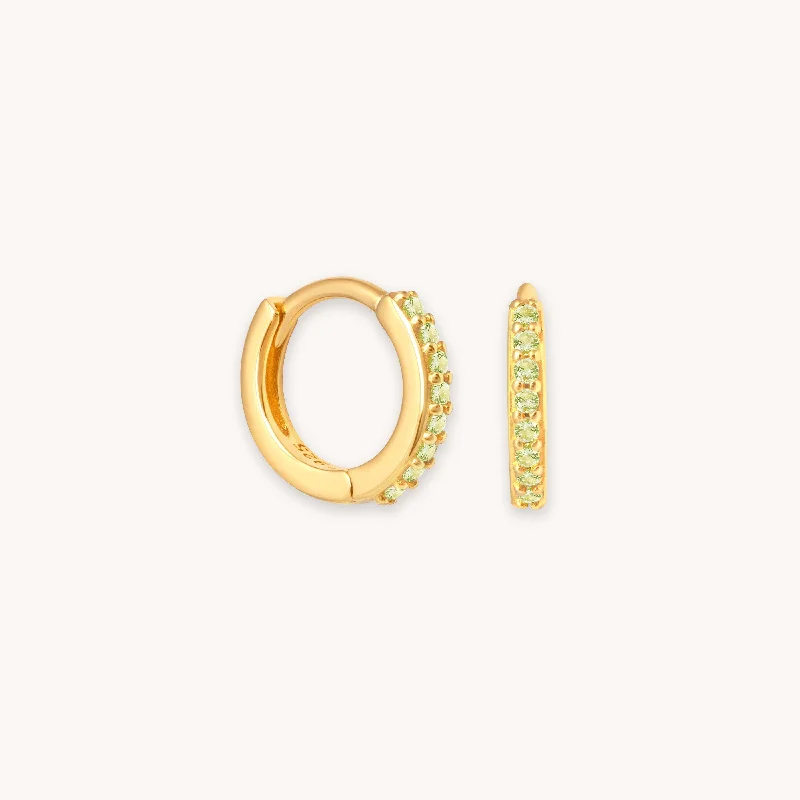 Don't Miss These Dazzling Jewelry Discounts August Birthstone Huggies in Gold with Peridot CZ Don't Miss These Dazzling Jewelry Discounts August Birthstone Huggies in Gold with Peridot CZ