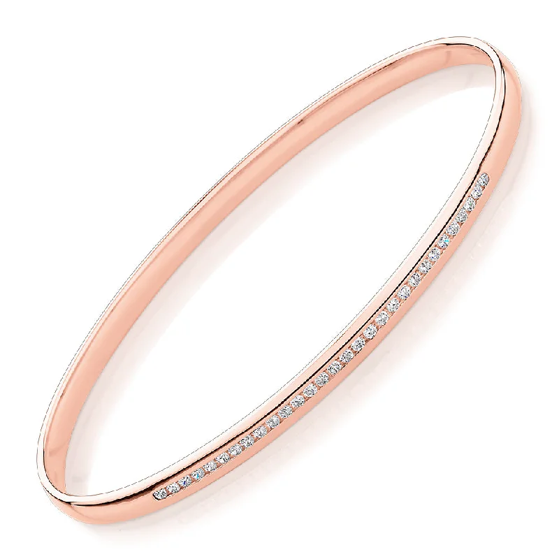 Bestselling Jewelry At Special Promotional Rates Oval bangle with 0.45 carats* of diamond simulants in 10 carat rose gold